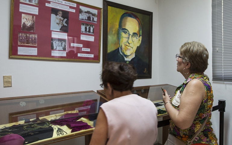 Women look at relics and other items of Salvadoran Archbishop Oscar Romero on March 22 at a museum dedicated to the late archbishop at Divine Providence Hospital in San Salvador. (CNS/Octavio Duran)