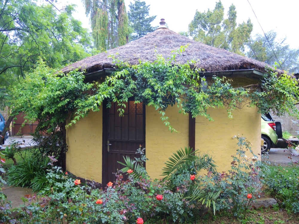 traditional Ethiopian tulkum, or round house, serves as a meeting room and counseling room at the Medhen Social Center in Addis Ababa, Ethiopia. Though the area around the Medhen Social Center is an urban slum, the campus is quiet and beautifully landscaped. (GSR photo / Melanie Lidman)