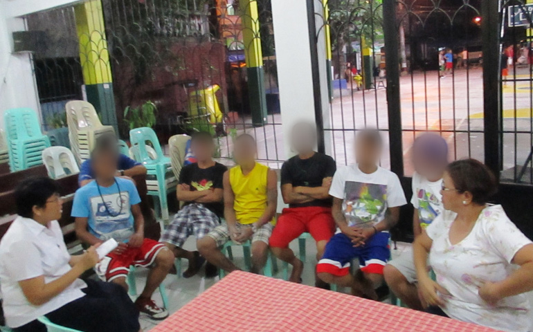 Sr. Maria Juanita "Nenet" Daño, far left, with drug users who came forward for counseling. At far right is the barangay (area) chairperson. (Contributed photo)