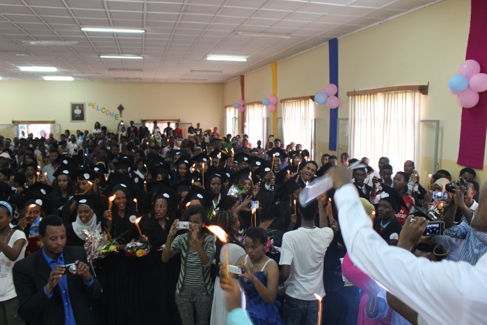 The theme of the graduation was “Go Light the World,” so at the end of the program all the students got a lighted candle, which they held while they sang. (Angela Mahoney)