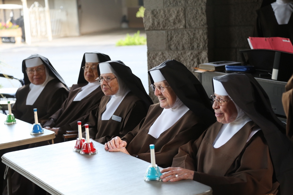 Some of the retired Carmelites enjoying a session of musical handbells. From left are Srs. Rosemarie, Alphonsina, Gema Alicia, Ann Dolores and Patrocinio -- who last year celebrated her 80th jubilee.. (Courtesy of Carmelite Sisters of the Most Sacred Heart of Los Angeles)