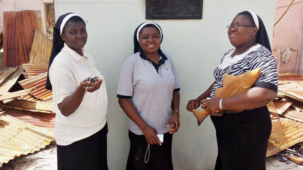 Sr. Christiana Akpah, center, alongside other two other Augustinian nuns, pays a visit to the ruined convent and hospital in Shuwa, Nigeria, on March 17, 2014*. (Festus Iyorah)