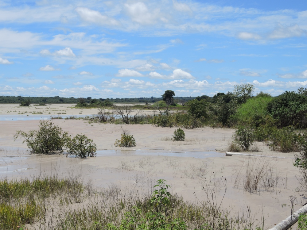 From the side, the Lubengele Tailings Dam can look almost peaceful. In an area where water can be scarce, there is a pleasant breeze from the dam. (Melanie Lidman)