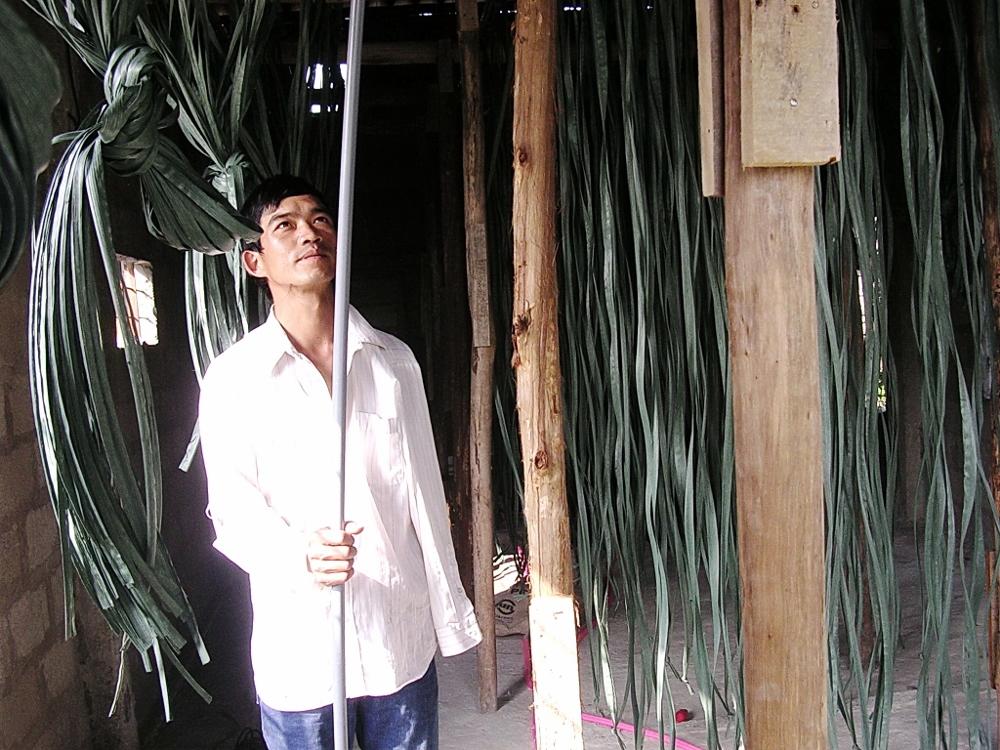 Tran Tien is fixing up his kitchen for mushroom production, March, 2013. (Peter Nguyen)