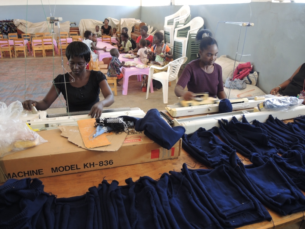 Women trained in weaving by the Franciscan Sisters make cardigans for school uniforms. (Melanie Lidman)