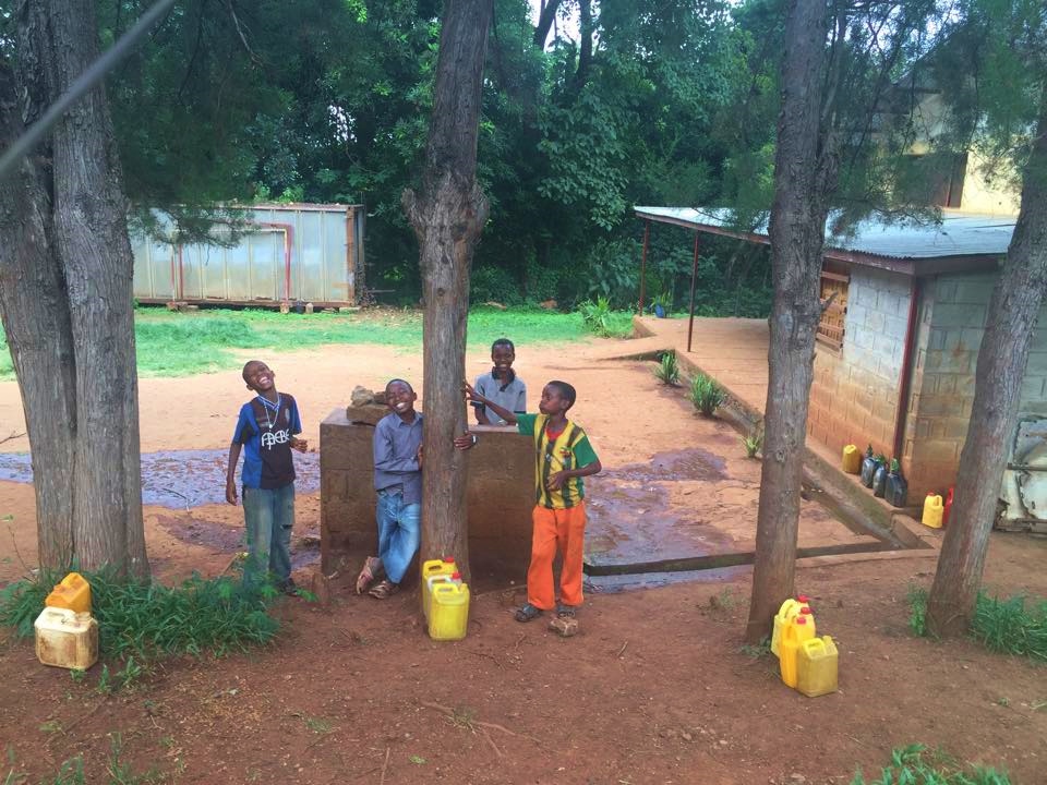 These are some of the boys who come to the compound to collect water to bring home. (Angela Mahoney)
