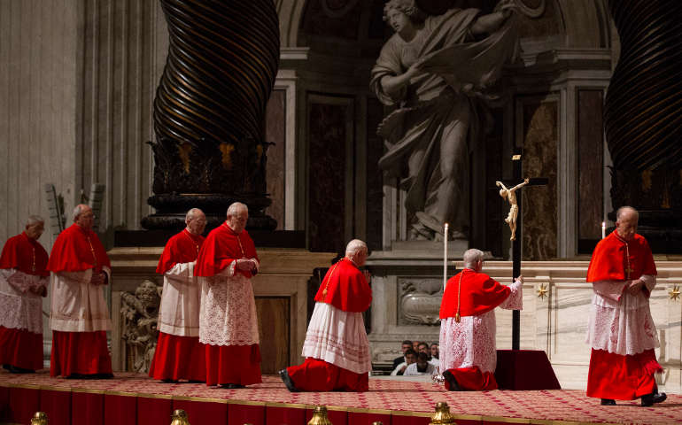 Cardinals venerate a crucifix during the Liturgy of the Lord's Passion on Good Friday in St. Peter's Basilica at the Vatican March 29. (CNS/Paul Haring)