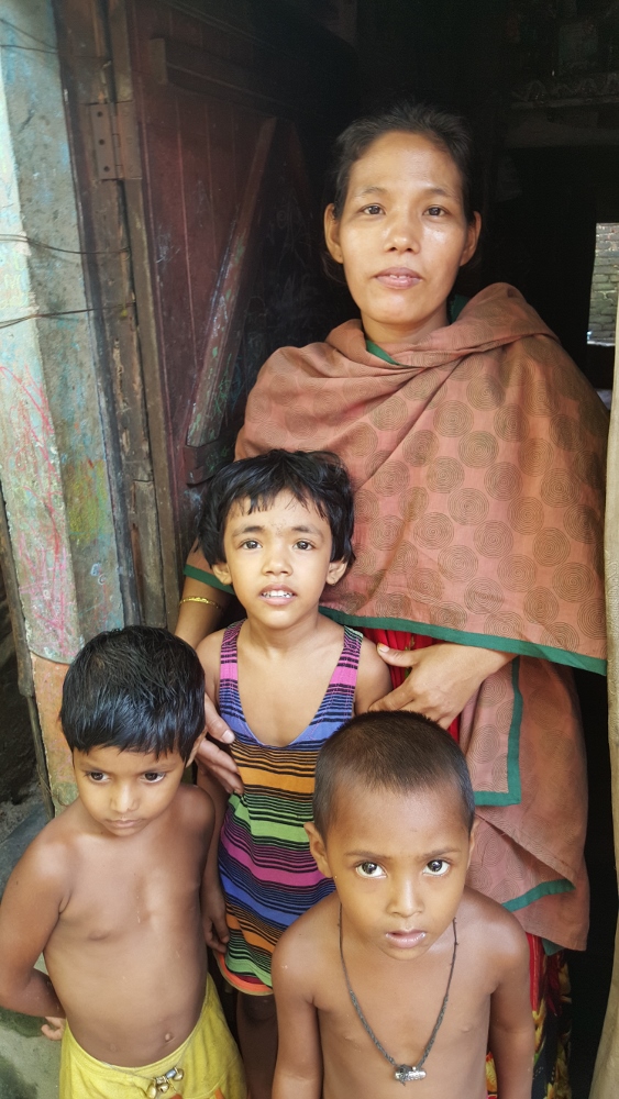 Lipti Costa and with her children and a neighbor child. The family remains in Chittagong because there is effectively no work in the rural area of Moymensingh, where the family has roots. (GSR photo / Chris Herlinger)