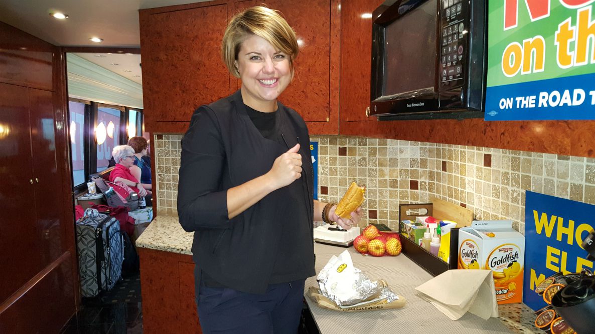 Abbey Watson, our trip director, cleans up the kitchen on the bus. (GSR photo / Michele Morek)