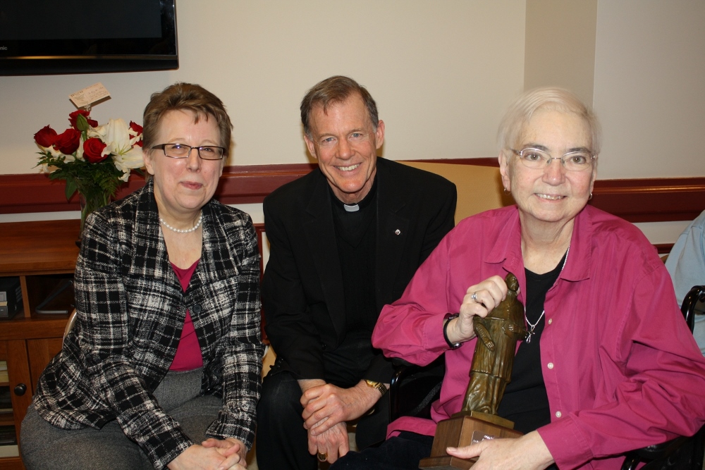 Helen Osman, from the USCCB, Bishop John Charles Wester, Honorary President of the Catholic Press Association sit with Sr. Mary Ann Walsh, right, who accepted the Catholic Press Assocation’s St. Francis de Sales Award for journalism March 12 at the Sisters of Mercy motherhouse in Albany, N.Y. (Courtesy of the Institute of the Sisters of Mercy of the Americas)
