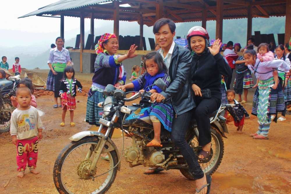Sr. Maria Kieu Thi Luong waves goodbye as she leaves the chapel. "Pastoral visits paid by clergy and religious help strengthen the Catholic faith of people who live in remote areas," she said. (Joachim Pham)