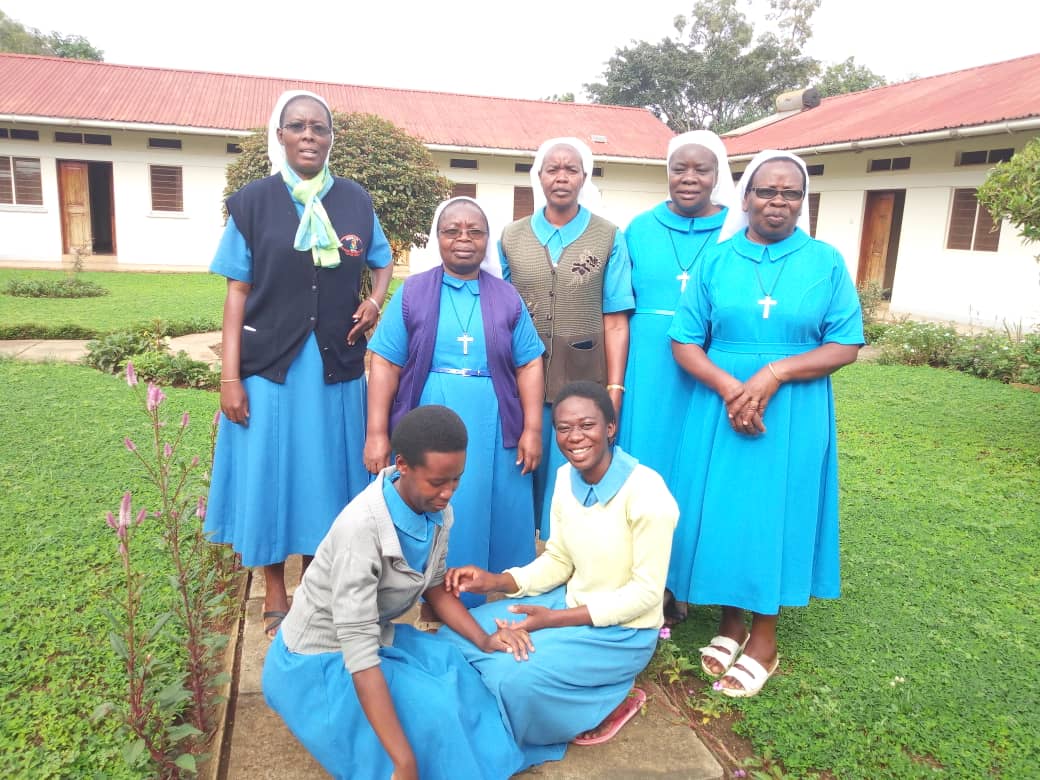 Missionary Sisters of the Blessed Virgin Mary, in a group photo; from left, Sr. Fulgence Aninayote, Mother Antonietta Bakosoro, Sister Mary, Sister Pasqualina, and Sister Elizabeth; in front row, novices Martha, left, and Mackline (Courtesy of Sr. Fulgence Aninayote)