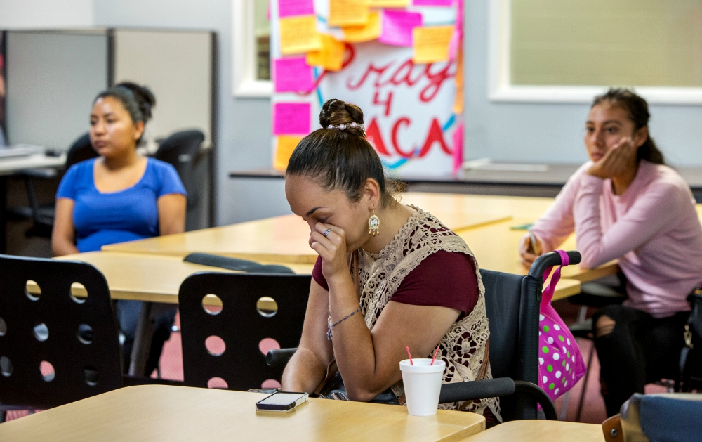 At the Coalition for Humane Immigrant Rights headquarters in Los Angeles, Paulina, 26, reacts to Attorney General Jeff Sessions' Sept. 5 announcement that the Deferred Action for Childhood Arrivals program is "being rescinded" by President Donald Trump. Paulina, a DACA recipient and graduate of UCLA, arrived in the U.S. when she was 6 years old. (Newscom / Reuters / Monica Almeida)