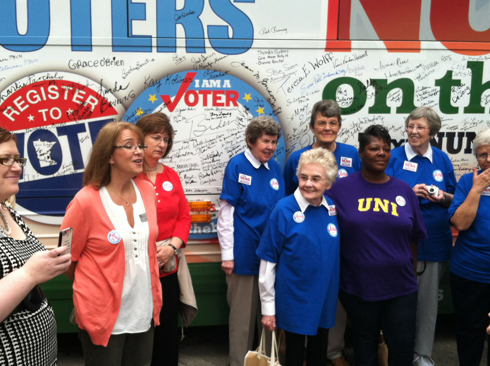 Signing the bus in Cedar Rapids, Iowa. (Courtesy of NETWORK)
