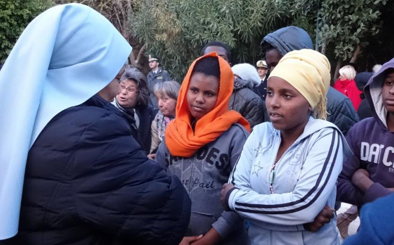 Sr. Lula Michael, a Santa Anna Daughter, meets Eritrean women on the island of Lampedusa in January 2016. (Courtesy of UISG)