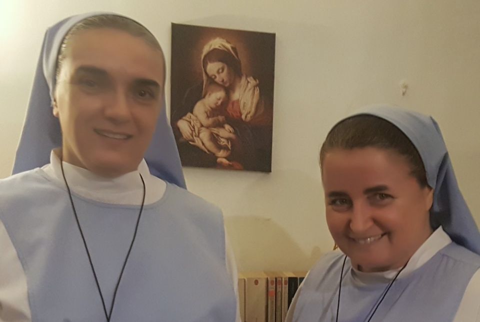 Two Catholic sisters in habits standing in a room together, Sr. Edith Fabian, left, and Sr. Sophie de Jésus