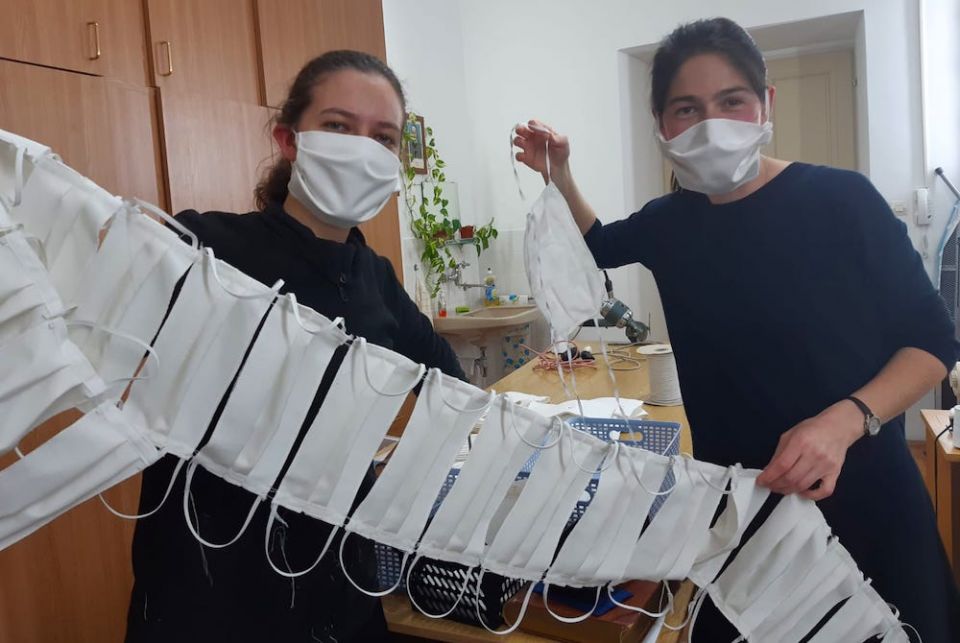 Candidates of Sisters of Mercy of the Holy Cross in Djakovo, Croatia, show a string of masks they have sewn to share with the people in the communities they serve. (Sr. Valerija Široki) Candidates of Sisters of Mercy of the Holy Cross in Djakovo, Croatia, show a string of masks they have sewn to share with the people in the communities they serve. (Sr. Valerija Široki)