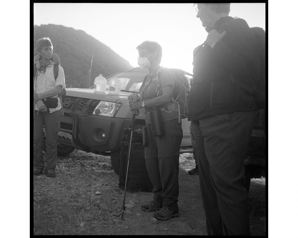 Before heading out for an arduous hike in the desert with water and food supplies, Ajo and Tucson Samaritans huddle together to plan the drop-off activities for the day.