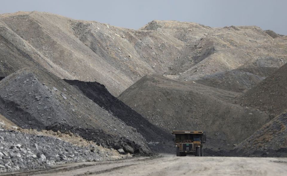 A dump truck hauls coal and sediment near Rock Springs, Wyoming, in 2017. Mining is one of many examples of the destruction of natural resources. (CNS/Reuters/Jim Urquhart)
