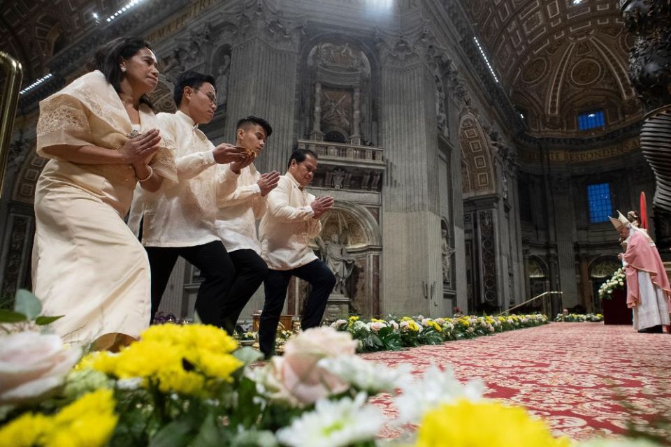 Members of the Filipino community in Rome approach the altar in the Vatican's St. Peter's Basilica during the offertory procession Dec. 15, 2019, as Pope Francis celebrates the first of the Simbang Gabi. (CNS/Vatican Media)