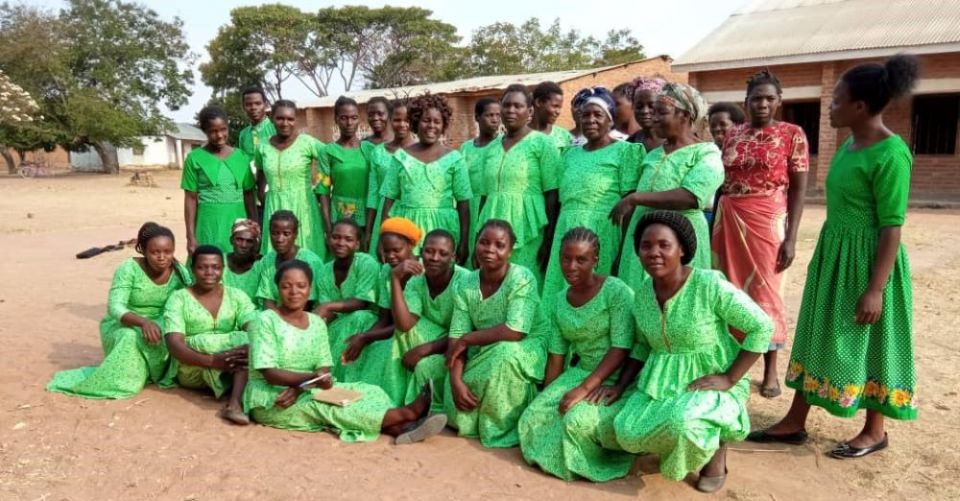 The Eco Women Group wear green to symbolize the environment. The sisters equip these women with skills to make briquettes, practice farming that does not adversely affect the environment and plant trees. (Photo courtesy of Sr. Patricia Chimimba)