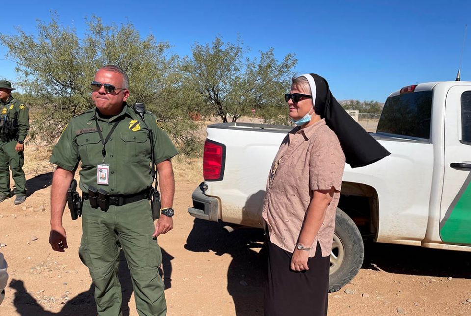 At the border of the Tohono O'odam Nation in Arizona, Felician Sr. Maria Louise Edwards, right, works with Officer Mario Agundez, founder of the Missing Migrant Program of the U.S. Border Patrol. Edwards is vice president of the Aguilas del Desierto.
