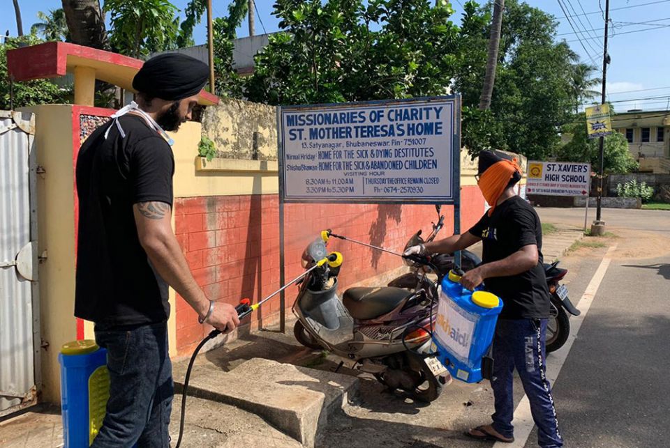Members of SikhAid sanitize the campus of the Missionaries of Charity and Mother Teresa's home for children and the destitute. (Courtesy of the SikhAid Youth Group)
