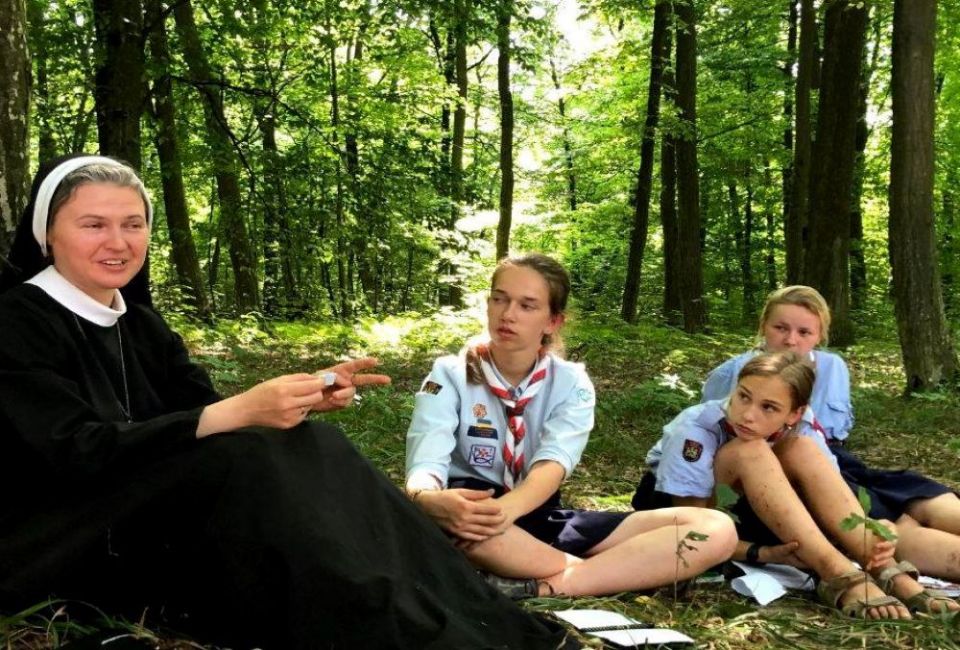 Mahdalyna Nadiya Vytvytska (left) meets with Girl Scouts at a 2020 summer camp session in Ukraine. She serves as assistant chaplain. (Courtesy of Mahdalyna Nadiya Vytvytska)