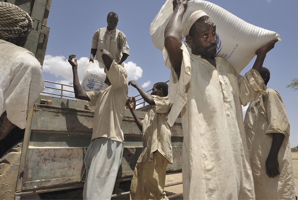 Food provided by the United Nations is unloaded in the Habile Camp for internally displaced Chadians outside the village of Koukou Angarana in Chad, in this 2008 file photo. (CNS/Paul Jeffrey)
