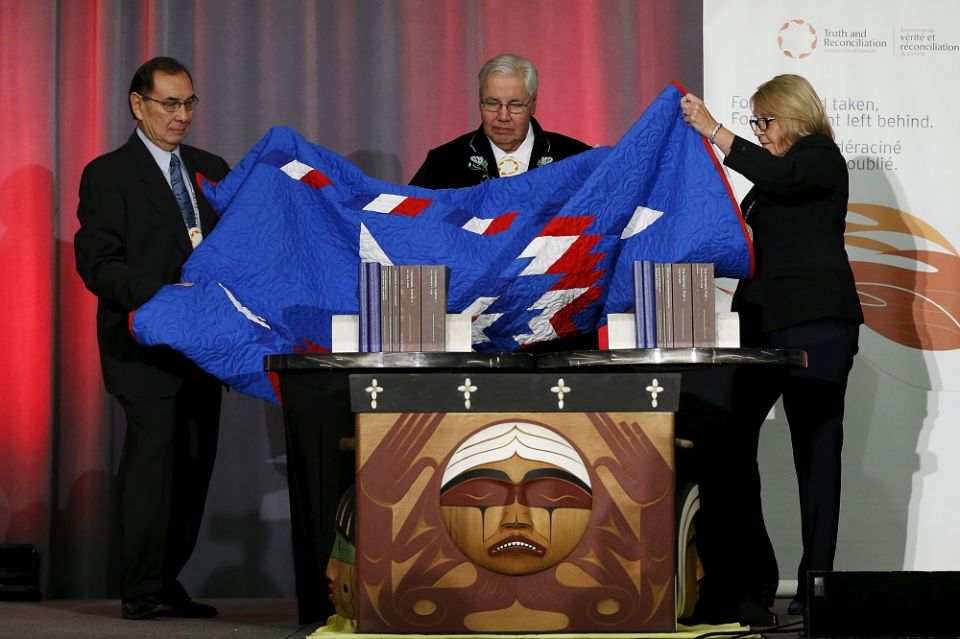 From left, Commissioner Chief Wilton Littlechild, Justice Murray Sinclair and Commissioner Marie Wilson unveil the Truth and Reconciliation Commission's final report Dec. 15, 2015, in Ottawa, Ontario. Canadian Prime Minister Justin Trudeau pledged to work