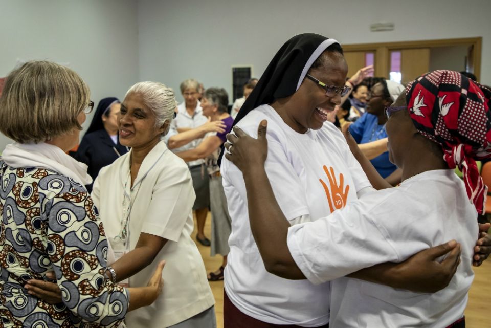Sisters hug one another in gratitude of the anti-trafficking work they do Sept. 27, the last day of the Talitha Kum 10th anniversary gathering in Rome. (Courtesy of Talitha Kum)