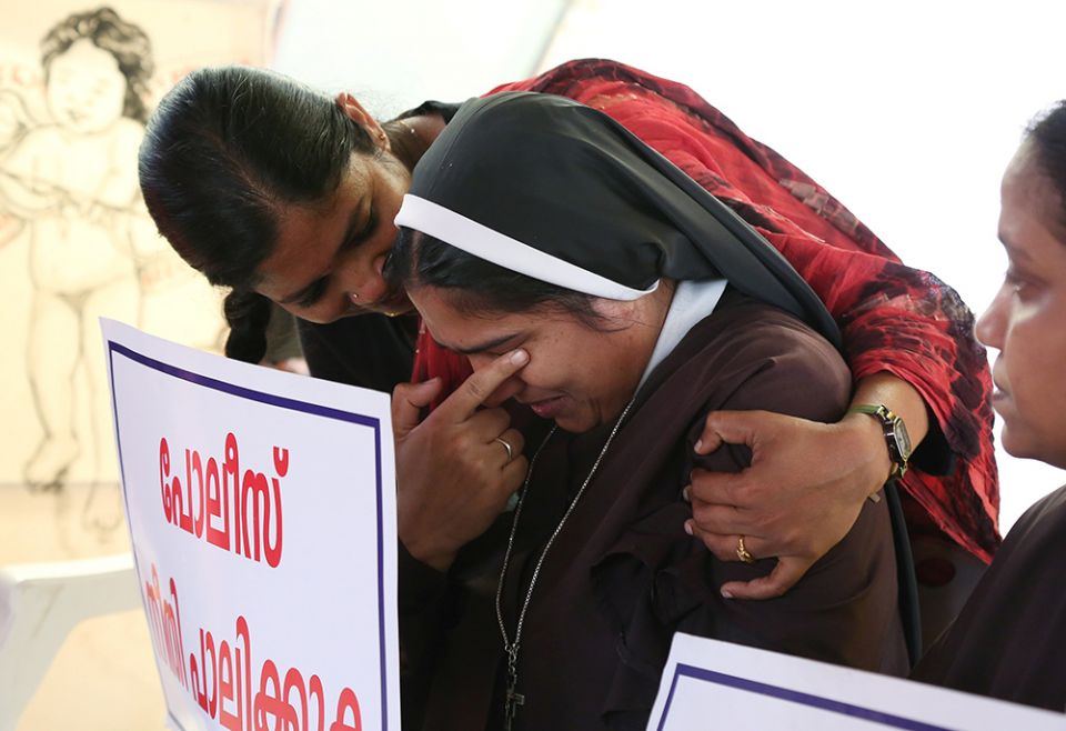 A woman religious is consoled during a Sept. 13, 2018, protest in Cochin, India, demanding justice after a nun accused Bishop Franco Mulakkal of Jalandhar of raping her. (CNS/Reuters/Sivaram V) A woman religious is consoled during a Sept. 13, 2018, protest in Cochin, India, demanding justice after a nun accused Bishop Franco Mulakkal of Jalandhar of raping her. (CNS/Reuters/Sivaram V)
