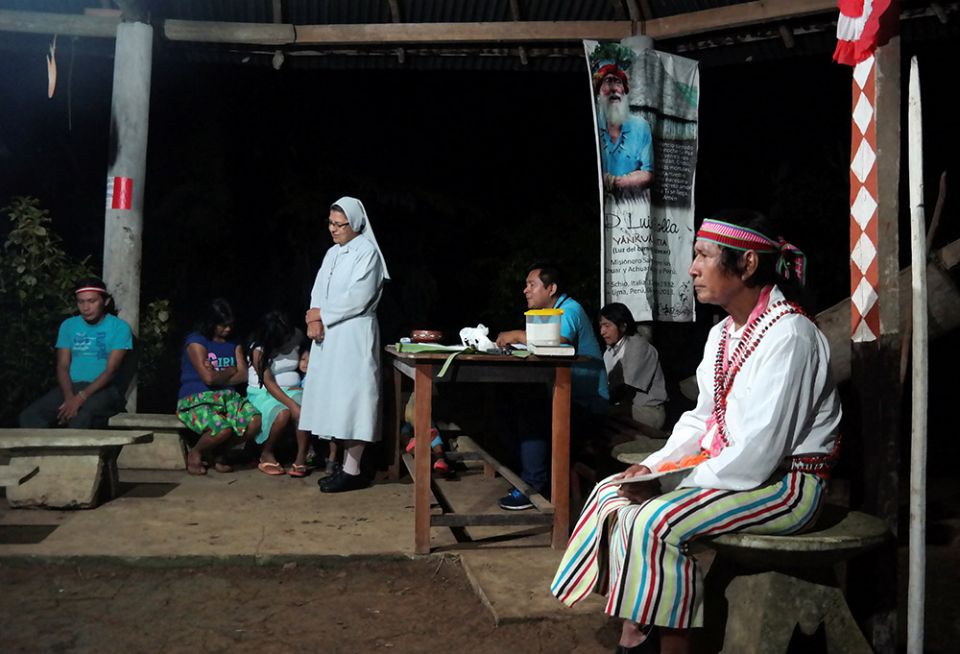 Deacon Shainkiam Yampik Wananch leads a liturgy with indigenous Achuar people at a chapel in Wijint, a village in the Peruvian Amazon, Aug. 20, 2019. (CNS/Reuters/Maria Cervantes)
