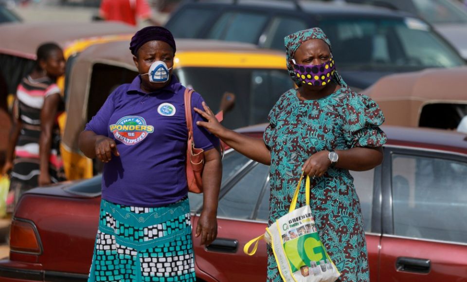 Women in Abuja, Nigeria, wear face masks May 2 during the coronavirus pandemic. Catholic sisters have also been active across Africa to disseminate information on hygiene and infection prevention. (CNS/Reuters/Afolabi Sotunde)