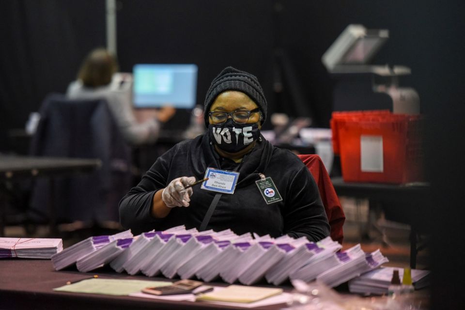 An election worker in Houston, Texas, processes mail-in ballots Nov. 2.