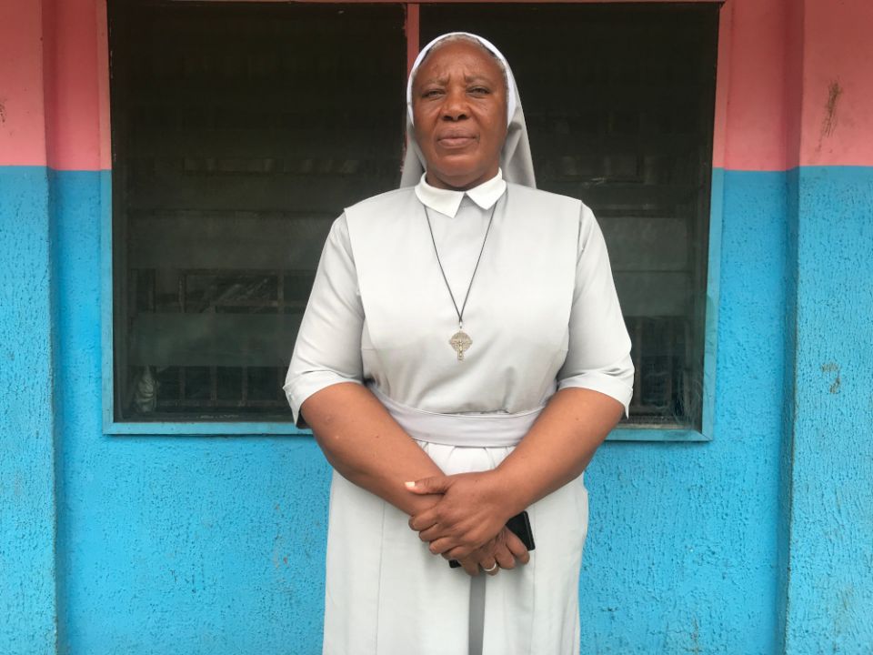 Sr. Matilda Iyang poses outside at the Mother Charles Walker Children Home Oct. 7, at the Handmaids of the Holy Child Jesus convent in Uyo, Nigeria. (CNS/Valentine Iwenwanne)