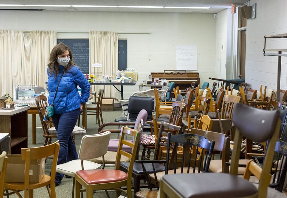 A woman in Farmington Hills, Michigan, browses items March 19 at the estate sale held by the Sisters of Mercy as they clean out their former convent. (CNS/Jim West) A woman in Farmington Hills, Michigan, browses items March 19 at the estate sale held by the Sisters of Mercy as they clean out their former convent. (CNS/Jim West)
