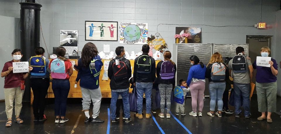 Mercy Srs. Terry Saetta, far left, and Patricia Mulderick, far right, pose for a photo May 7, 2021, at the "respite center" in McAllen, Texas, where they volunteered to help migrants.