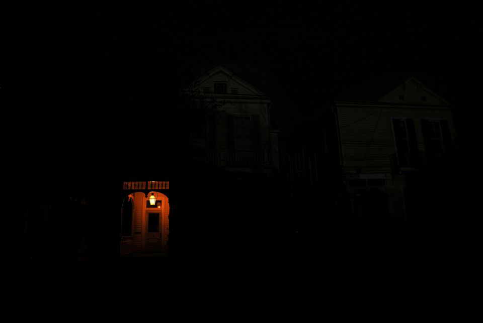 A front porch in New Orleans lit by a flame A front porch in New Orleans is lit by a flame on a dark street Aug. 31 in the midst of a power outage caused by Hurricane Ida. (CNS/Reuters/Leah Millis)