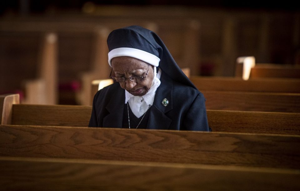 Oblate Sr. Magdala Marie Gilbert, 91, prays during a  Feb. 9 Mass in the chapel of the motherhouse of the Oblate Sisters of Providence near Baltimore. (CNS/Chaz Muth)