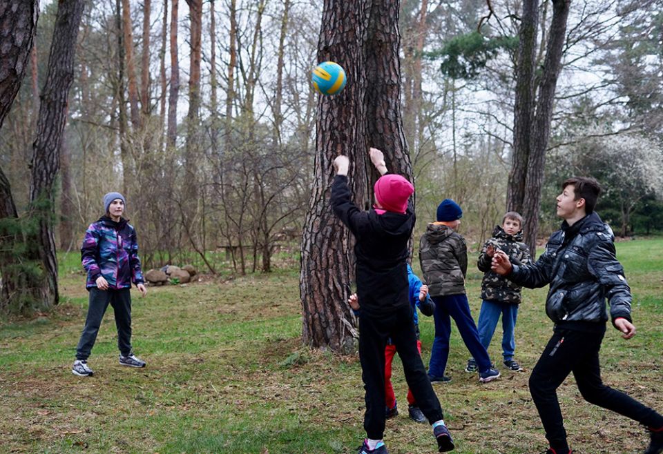 Ukrainian children from a group home for orphans in Zhytomyr, Ukraine, play in the yard of the motherhouse of the Congregation of the Sisters of the Angels April 20 in Konstancin-Jeziorna, Poland. (CNS/Adrian Kowalewski)