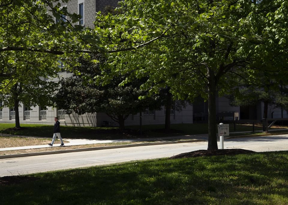 A person in Washington walks along Sister Thea Bowman Drive at the Catholic University of America in Washington on April 29. (CNS/Tyler Orsburn)