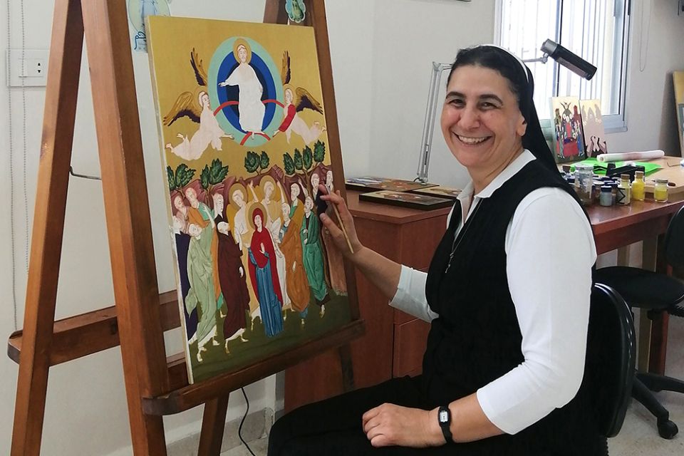 Melkite Sr. Souraya Herro poses with some of her artwork Sept. 7 in her workshop at the convent of Our Lady of the Annunciation in Zouk Mosbeh, Lebanon. (CNS/Doreen Abi Raad)