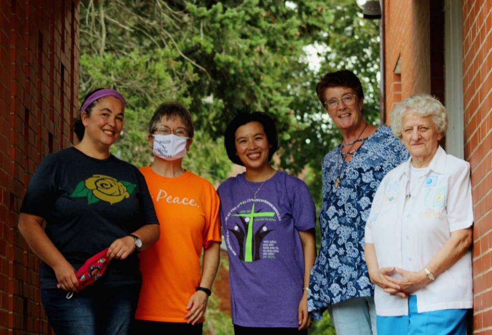 Outside the back door of the New Haven Dominicans of Peace convent, from left, Srs. Ana Gonzalez, June Fitzgerald, Lovers of the Holy Cross Sr. AnHoa Nguyen (a visiting scholar from Vietnam), Dominican candidate Cathy Buchanan, and Sr. Julia Grey Outside the back door of the New Haven Dominicans of Peace convent, from left, Srs. Ana Gonzalez, June Fitzgerald, Lovers of the Holy Cross Sr. AnHoa Nguyen (a visiting scholar from Vietnam), Dominican candidate Cathy Buchanan, and Sr. Julia Grey