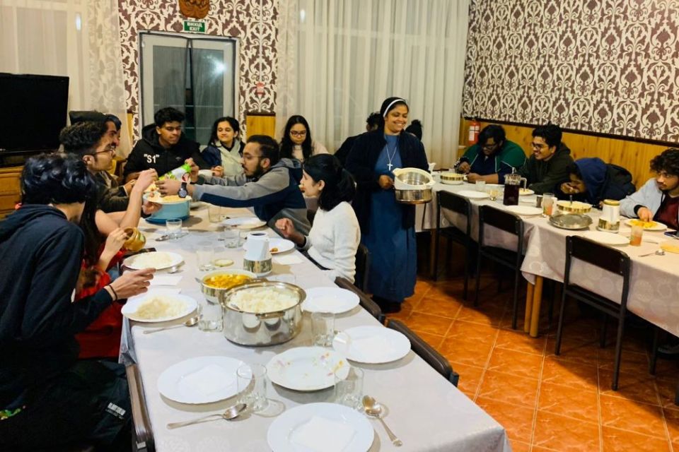 The Sisters of St. Joseph of Saint-Marc at Mukachevo, Ukraine, serve food to rescued foreign students before helping them to cross the border. (Courtesy of Ligi Payyappilly)