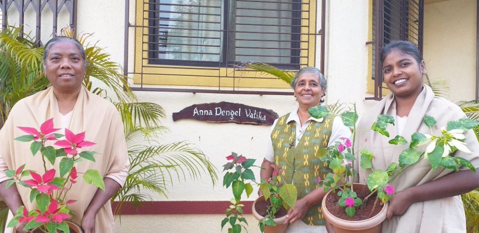 Medical Mission Sr. Rowena Miranda, center, stands with sisters in front of the convent at the eco-health center Samanvaya. (Courtesy of Rowena Miranda)