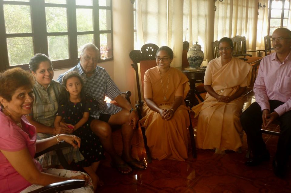 Sr. Jyothi Kerketta and Sr. Celine Sebastian of the Daughters of St. Paul converse with a family in the Fontainhas neighborhood of Panjim India. (Lissy Maruthanakuzhy)