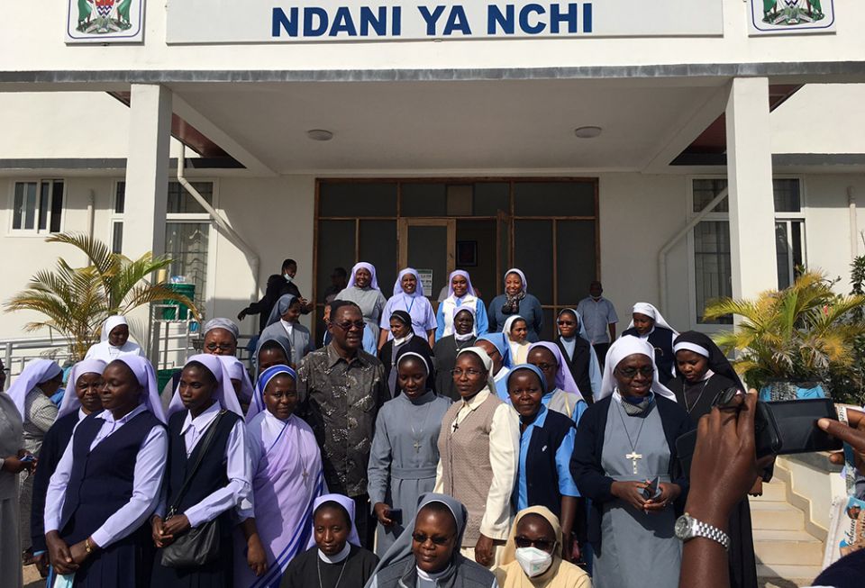 A delegation of sisters and workshop facilitators stands with George Simbachawene, minister of home affairs of Tanzania. (Courtesy of Sr. Eucharia Madueke) A delegation of sisters and workshop facilitators stands with George Simbachawene, minister of home affairs of Tanzania. (Courtesy of Sr. Eucharia Madueke)