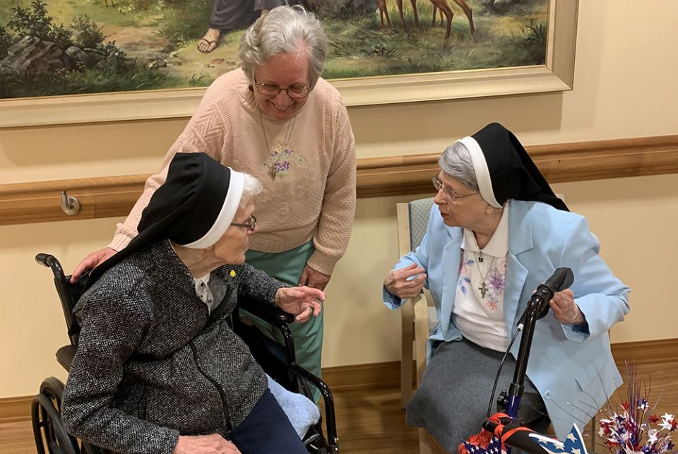 Sr. Benilda Nadolski, 99, left, the eldest of the Franciscan Sisters of St. Joseph and in the 79th year of her religious profession, converses with Sr. Marcia Ann Fiutko, center, and Sr. Alexine Machowicz, 89, at St. Francis Park this past spring. (Courte Sr. Benilda Nadolski, 99, left, the eldest of the Franciscan Sisters of St. Joseph and in the 79th year of her religious profession, converses with Sr. Marcia Ann Fiutko, center, and Sr. Alexine Machowicz, 89, at St. Francis Park this past spring. (Courte