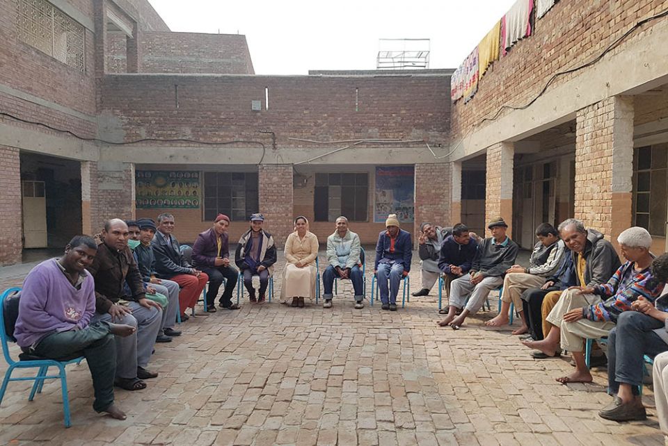 Sr. Mariam Gill with male residents of Dar ul-Karishma (Kamran Chaudhry)
